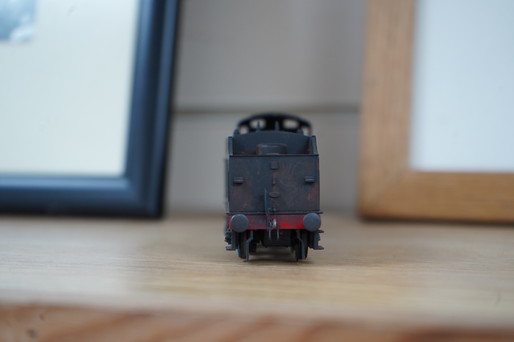 Two kit built and adapted EM gauge LMS railway locomotives; an 0-8-0, 9518, and an 0-6-0 class 4F based on an Airfix kit, together with the body only of an SR Schools Class